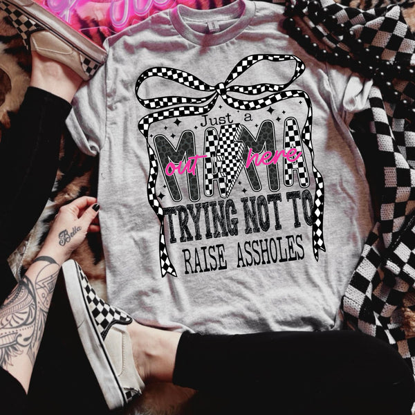 Just a mama trying not to raise assholes tee