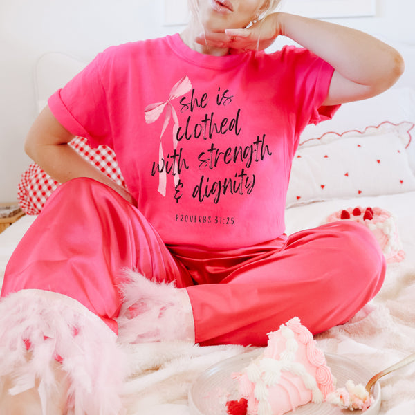 She is clothed with strength and dignity pink tee