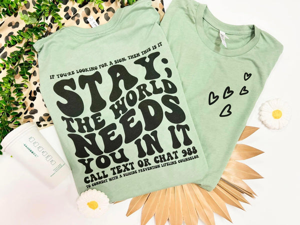 Stay, the world need you in it tee