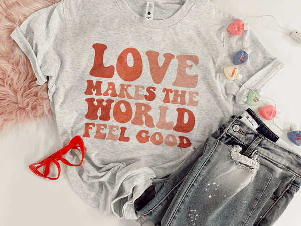 Love makes the world feel good tee